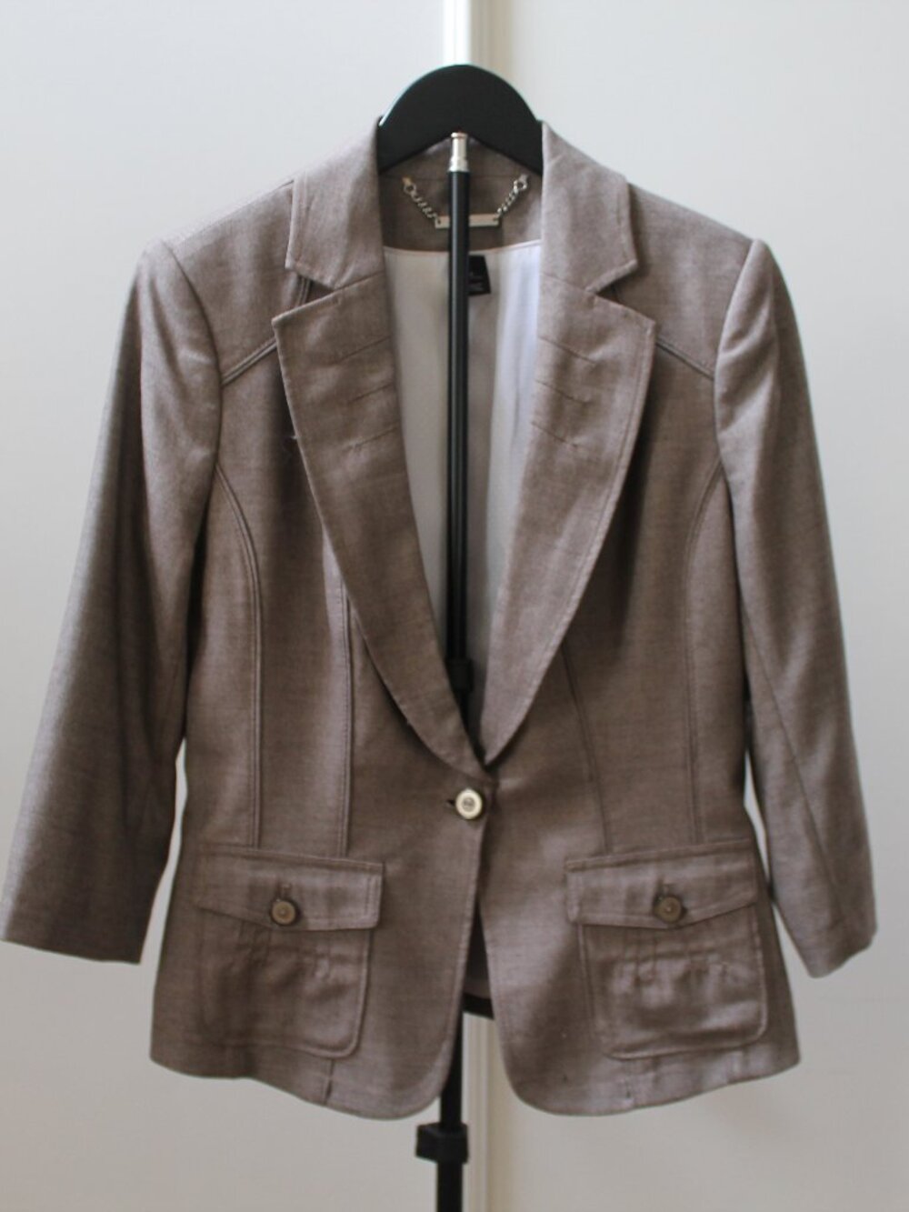 White House Black Market brown blazer featuring a single-button closure and thre